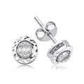 Round diamond stud earrings with faceted silver setting on white background