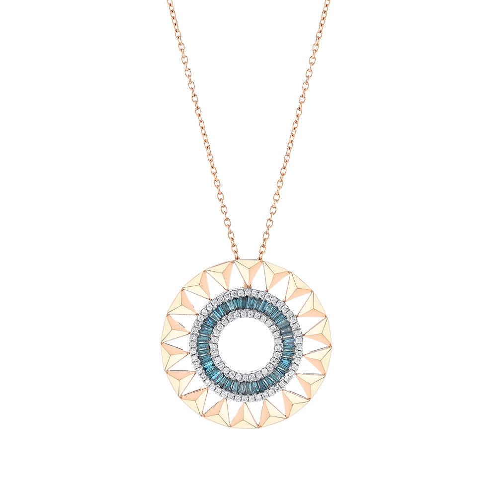 Round gold pendant necklace with blue and white gemstones in a geometric pattern