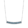 White gold necklace with blue baguette and round white diamonds in a curved bar design