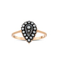 Rose gold ring with pear-shaped black and white diamond cluster design