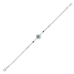 Elegant silver bracelet with deep blue gemstones and clear diamond accents on white background